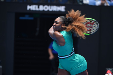 Serena Williams hitting a backhand during her first round match at the Australian Open 2019